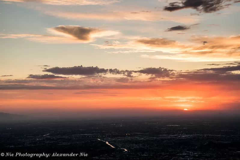 The sun begins to dip below the horizon on June 4th in Phoenix, Arizona. Taken at the summit of Piestewa Peak.

