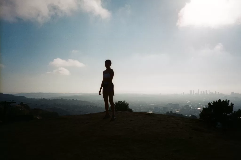 Runyon Canyon Park trail with panoramic view of Los Angeles city