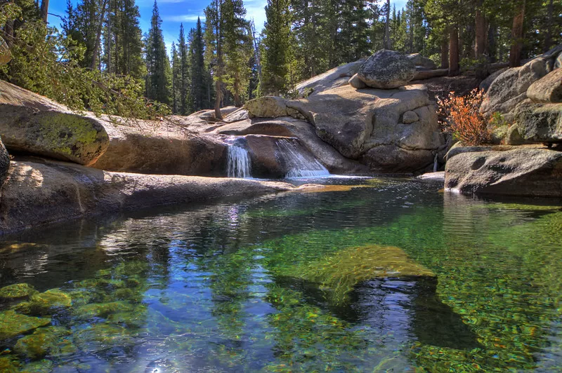 Tuolumne Meadows, Yosemite, CA (HDR)
There is nothing better than hiking a trail, hearing the rushing water, and then coming to a small waterfall and clear pool. This is on the John Muir Trail.

